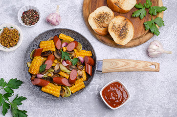 Slices of fried vegetables with sausages