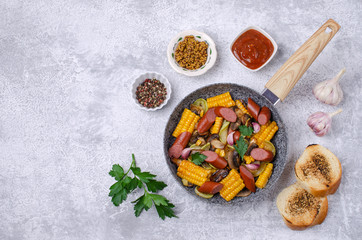Slices of fried vegetables with sausages