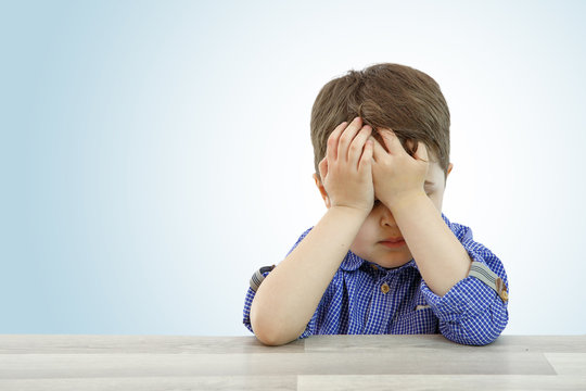 little cute boy with different emotions on face on isolated background