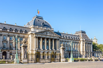 Fototapeta premium Three-quarter view of the colonnade and grid of the Royal Palace of Brussels, the official palace of the King and Queen of the Belgians in the historic center of Brussels, Belgium, on a sunny day.