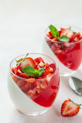 coconut and strawberry jelly layered dessert with fresh berry