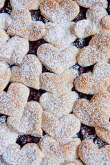 Cherry pie with heart shaped on the rustic background