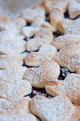 Cherry pie with heart shaped on the rustic background