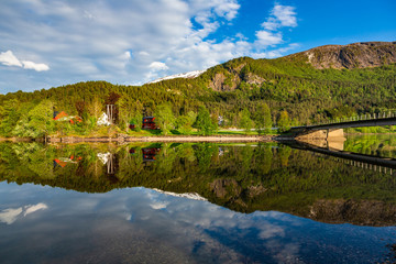 Fototapeta na wymiar Small village near lake in Hordaland, Norway.