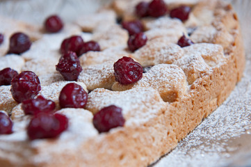 Cherry pie with heart shaped on the rustic background