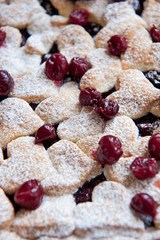 Cherry pie with heart shaped on the rustic background