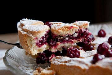 Cherry pie with heart shaped on the rustic background