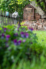 A nice wooden bug house in the garden