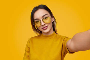 Pretty woman taking selfie