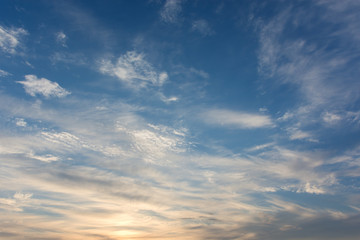 Feathery clouds in the evening sunset sky