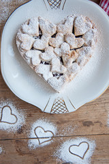 Cherry pie with heart shaped on the rustic background