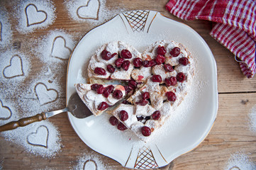 Cherry pie with heart shaped on the rustic background