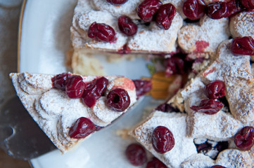 Cherry pie with heart shaped on the rustic background