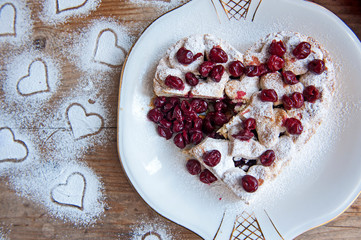 Cherry pie with heart shaped on the rustic background
