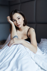 Naklejka premium Young beautiful girl wake up in the morning at home