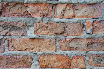 Bricks background and textures on the wall. Poor brick cracks. Slits Damage. Scratches.