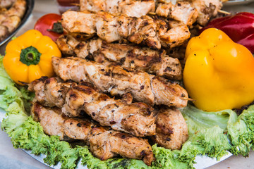 Grilled meat on the grill with fresh vegetables. Street food