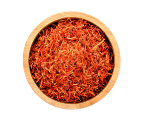 Safflower dried in wood bowl on white background