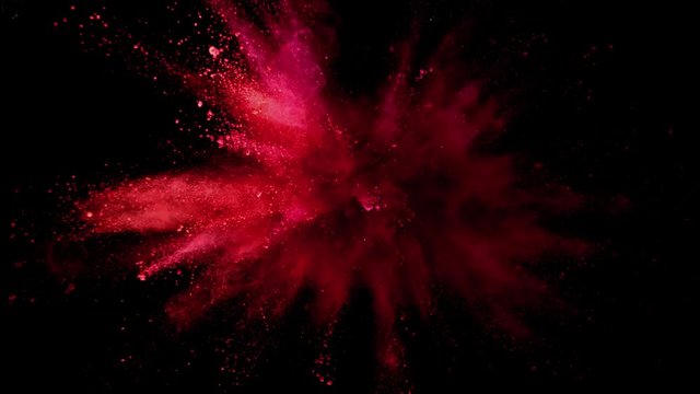 Super slow motion of coloured powder collision isolated on black background. Filmed on high speed cinema camera, 1000fps.