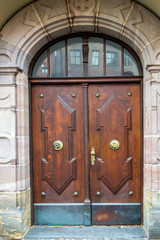 Elegant wooden front door with arch
