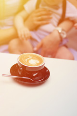 Cup of coffee with beautiful Latte art.hot latte coffee put on wooden table in cafe restaurant, stylish toning, place for text.