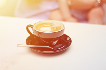 Cup of coffee with beautiful Latte art.hot latte coffee put on wooden table in cafe restaurant, stylish toning, place for text.