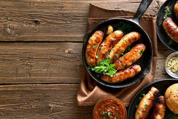 Fried sausages in frying pan