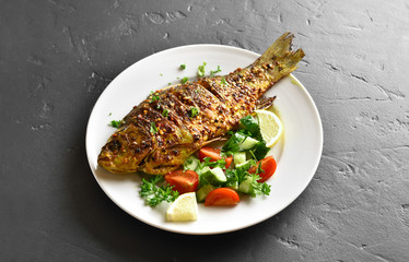Roasted fish on plate