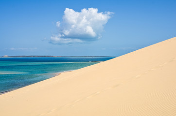 White beach with tropical sand and coral and blue sea background. Mozambique. Vilankulos