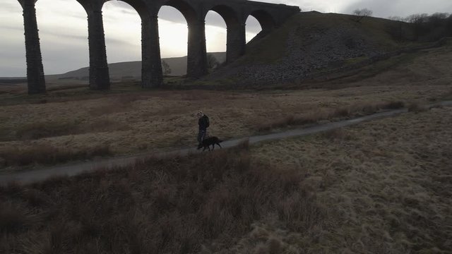 Drone dog walker at Ribblehead Viaduct, Yorkshire