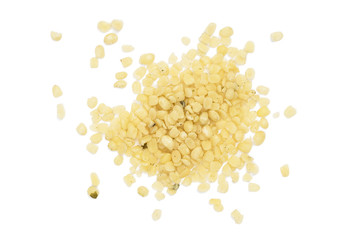 Spread out pile of shelled or peeled hemp seeds seen directly from above and isolated on white background