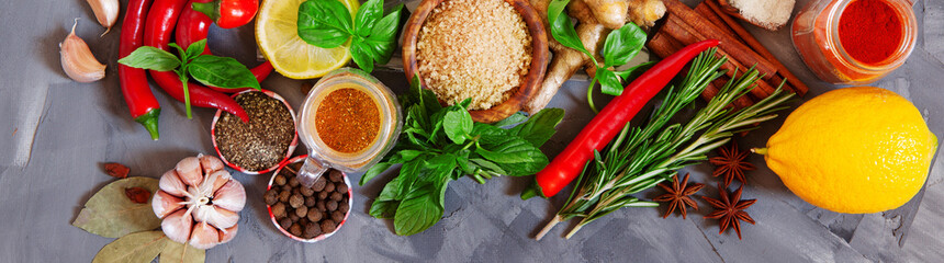 Variety of spices and herbs on kitchen table top view