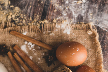 Cinnamon and eggs are placed on the sack and the flour