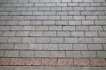 View of the gray granite paving of rectangular shape. Texture backgrounds for Wallpaper graphics design