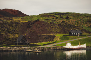 Fototapeta premium Stafkirkjan a fooden replica of nordic church given by Norway to iceland situated in the habour of Heimaey Westman Islands 