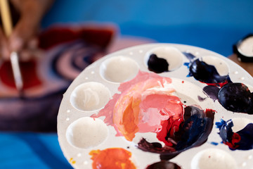 Close up of different color oil paint, Patterns or backgrounds of various colors, colors on the fabric.