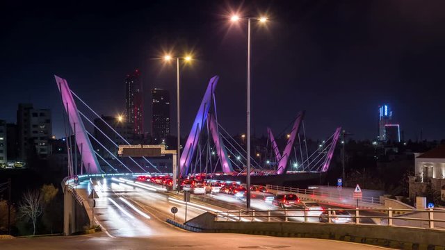 Illuminated Wadi Abdoun bridge at night, Amman, Jordan. Car traffic, time lapse video