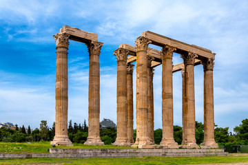 Athens, Attica / Greece. The Temple of Olympian Zeus, also known as the Olympieion or Columns of the Olympian Zeus, is a former colossal temple at the center of Athens. Sunny day, cloudy sky, nobody