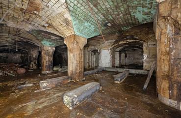 Interior of an abandoned underground wine warehouse of the 19th century