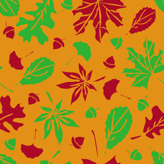 Autumn seamless vector pattern. Fall leaves and acorns. Beautiful Halloween colors.
