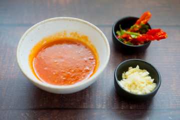 Sauce for Shabu shabu style with side dish on wood table