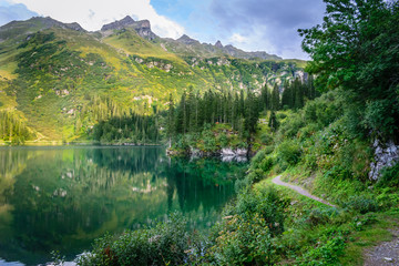 Beautiful idyllic swiss Alps landscape with mountains and Garichtisee lake in summer, Freiiburg Kärpf, Canton Glarus