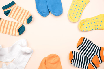 Child's socks frame empty space background.