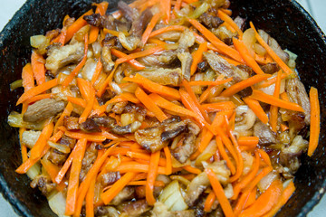 hot appetizers, grilled meat with carrots and onions