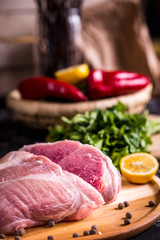 Raw pork on a wooden board