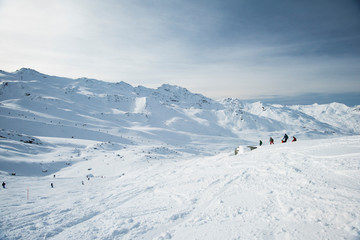 Fototapeta na wymiar Skiers off piste in alpine ski resort