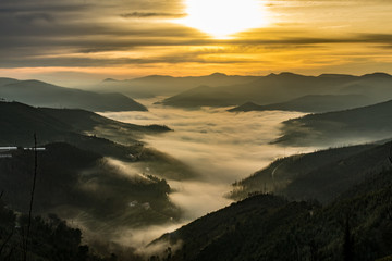 sunrise in mountains with fog
