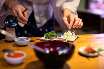 Obraz na płótnie Canvas preparing cooking and serving japanese food