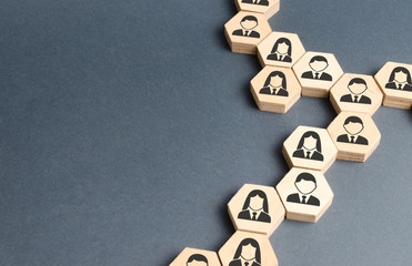 Symbols of employees on the chains of hexagons. The concept of business connections. Team building,...