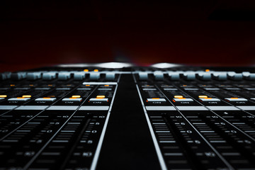 Closeup view of Faders on Professional digital Audio mixing control Console